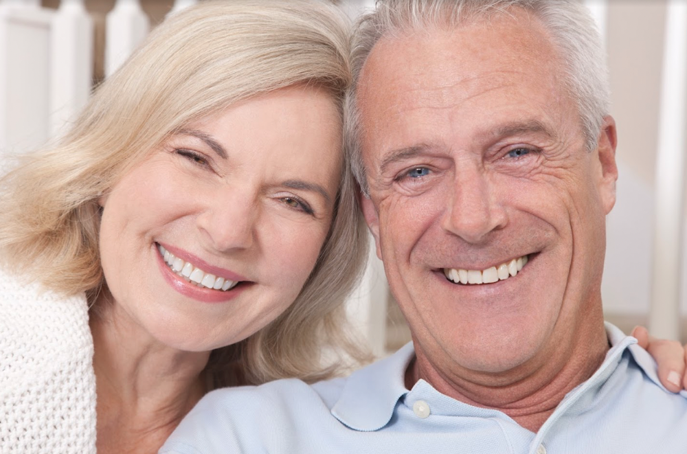 couple smiling after gum disease treatment in Moorabbin