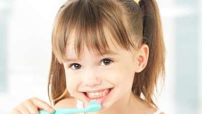Little girl brushing her teeth in Black Rock VIC